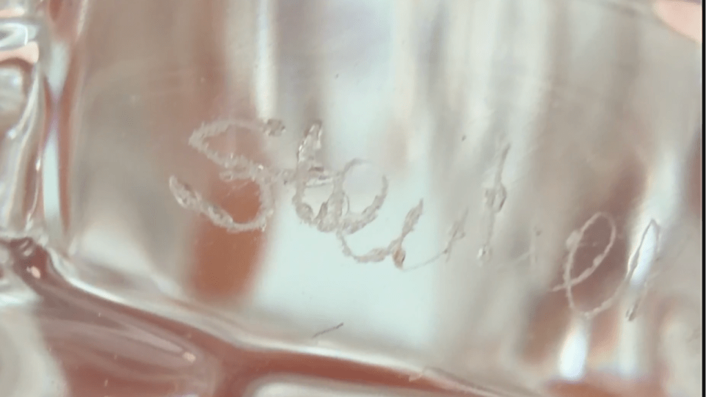 Etched maker's mark on a Steuben glass turtle