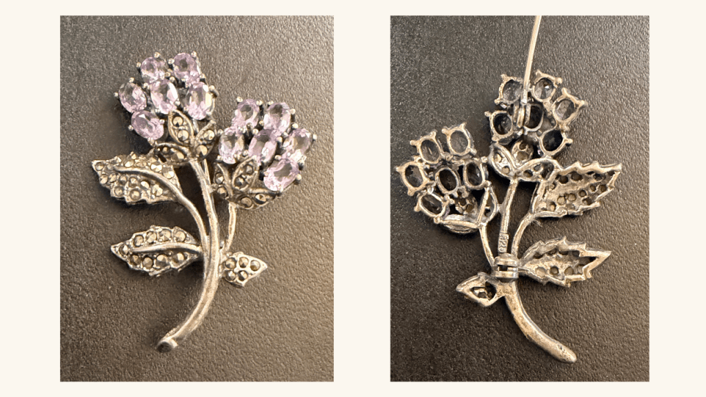 Front and back of a vintage sterling silver brooch showing jewelry construction and clasp