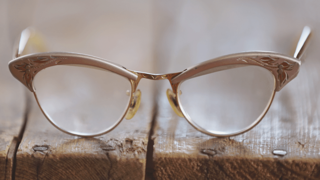 Vintage pink cat-eye eyeglasses with decorative metal frames