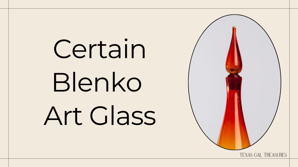 Red and orange vintage art glass decanter with tall pointed glass stopper